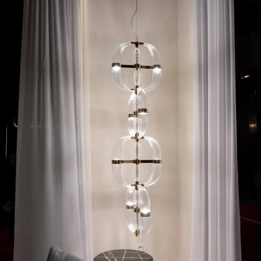 Distinguished Patrizia Garganti Coup De Foudre 04 suspension lamp crafted in hand-blown glass with a glossy golden metal finish