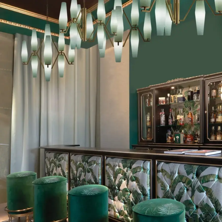Distinguished Patrizia Garganti Frida chandelier crafted in gently tapered opaque glass with warm gold-toned metal finish
