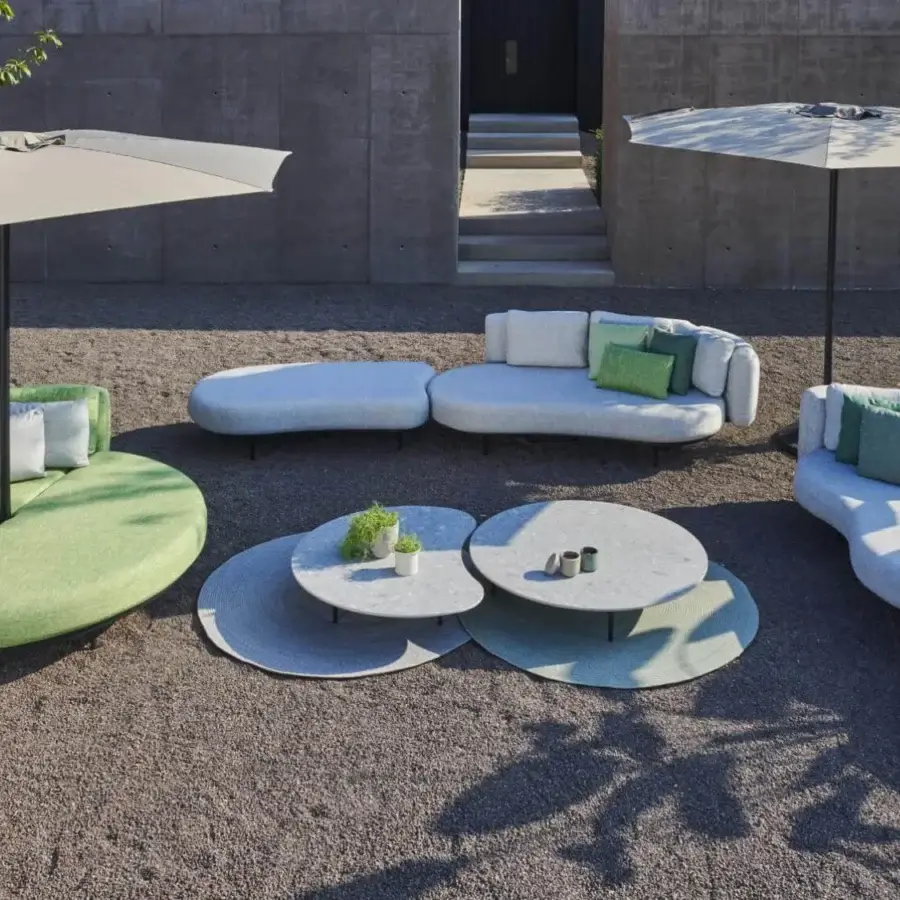 Exceptional Royal Botania Organix lounge coffee tables with speckled ceramic tops in light gray and muted green hues with matte finish