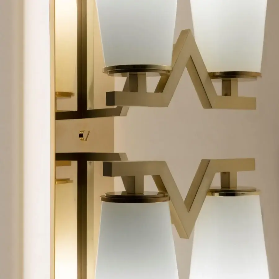 Elegant Patrizia Garganti Frida wall lamp crafted in hand-blown opaque glass with a polished golden metal frame