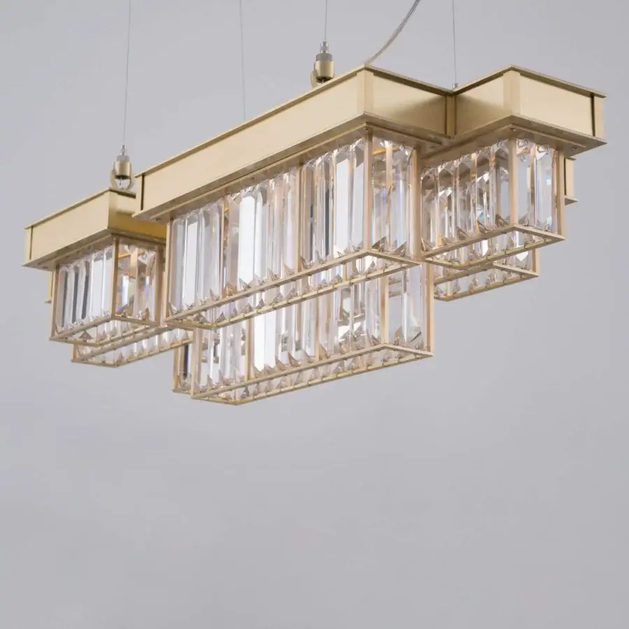 Distinguished Patrizia Garganti Gisele suspension lamp crafted in laser-cut steel with clear glass elements and a warm gold finish