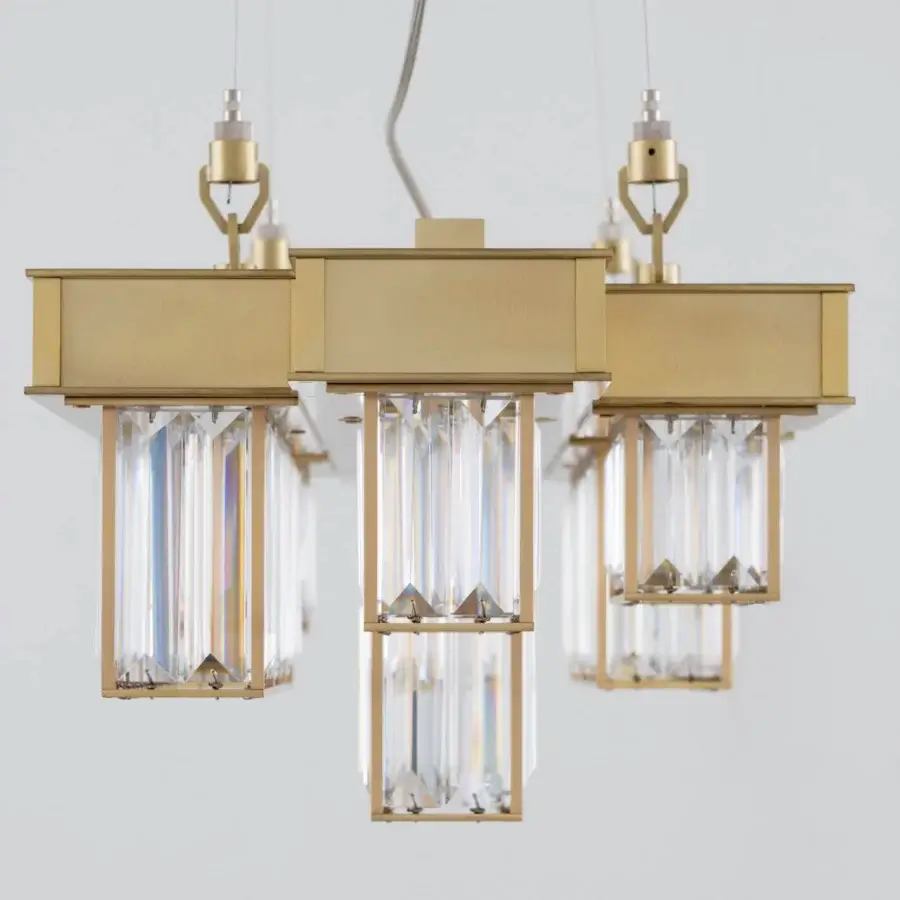 Elegant Patrizia Garganti Gisele suspension lamp in geometric design with warm gold-finished laser-cut steel and clear glass prisms