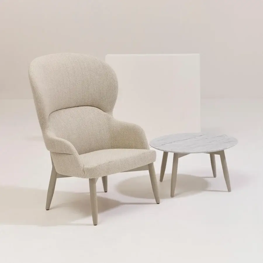 Distinguished Billiani Spy Lounge chair with gently curved silhouette upholstered in muted beige textile and light-toned wooden base