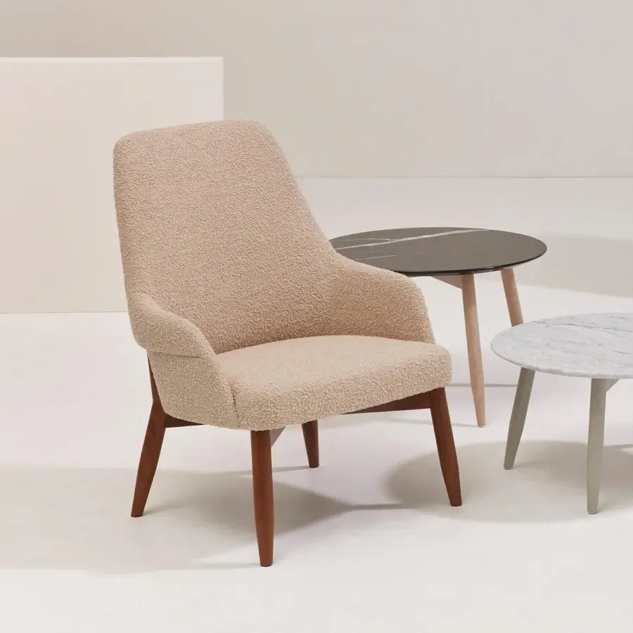 Superior Billiani Spy Lounge chair with gently curved fully upholstered form in creamy beige bouclé-like textile and satin-finish wooden base