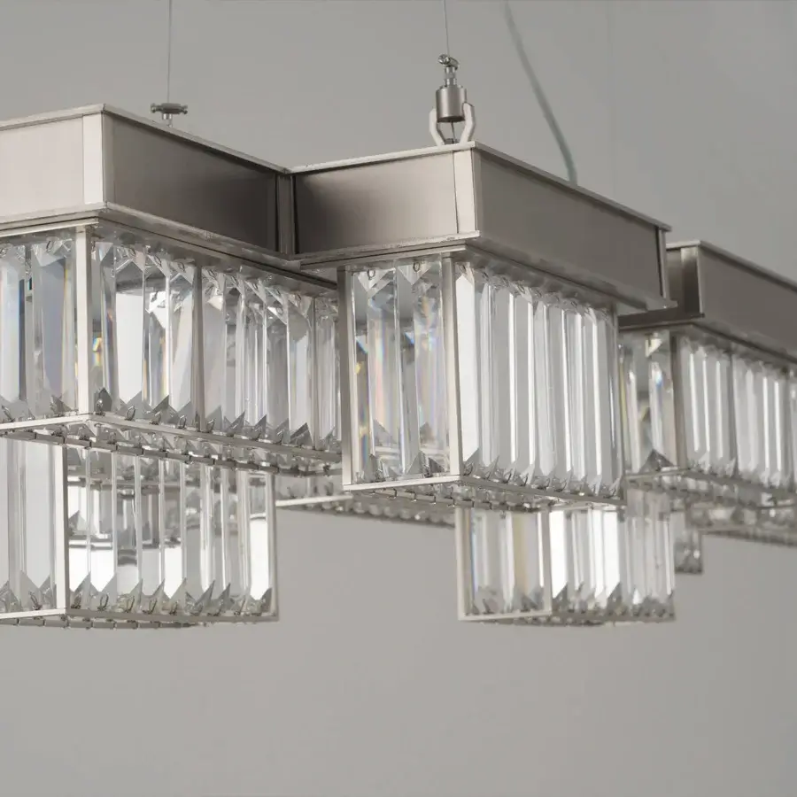 Distinguished Patrizia Garganti Gisele suspension lamp crafted with interconnected steel modules and faceted clear glass in a brushed silver-grey finish