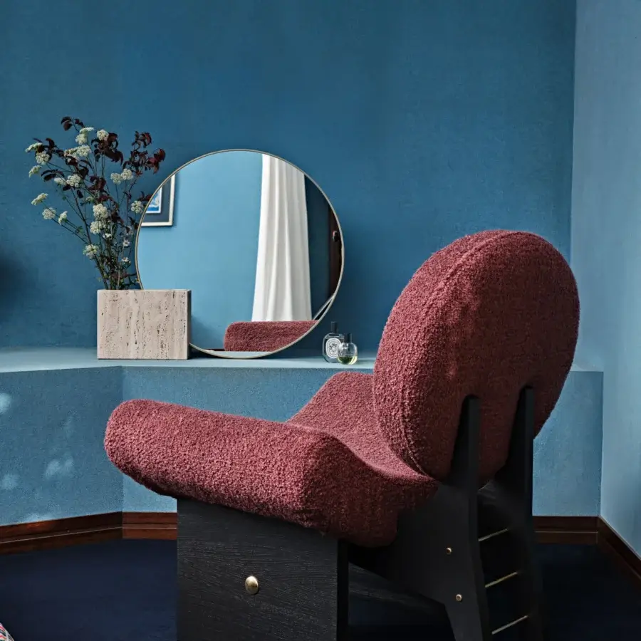 Exquisite Black Tie Onika lounge chair with rose-toned bouclé upholstery and dark matte solid wood frame