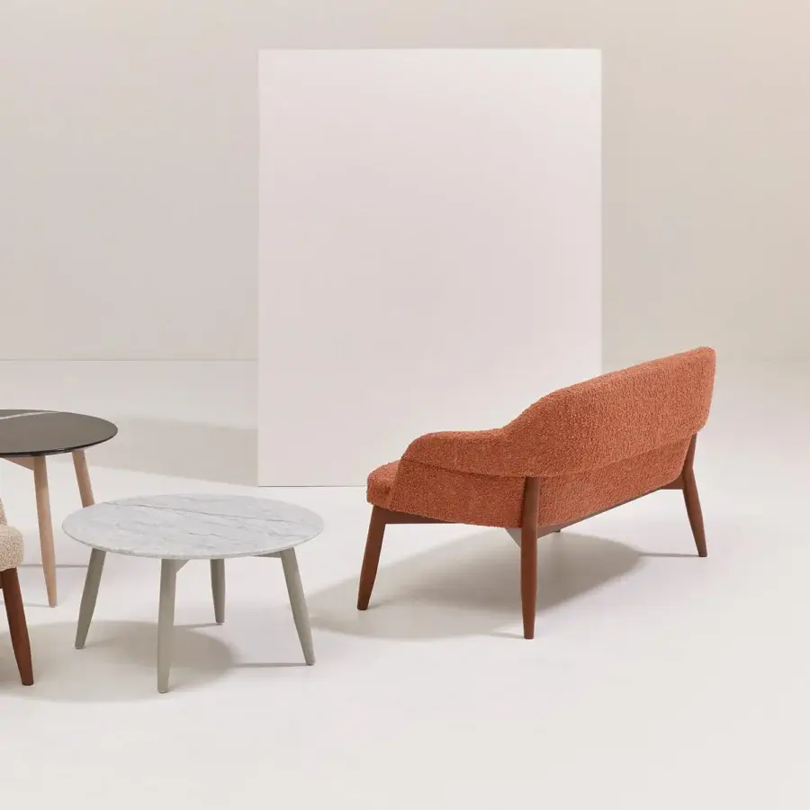 Distinguished Billiani Spy sofa with inviting rounded form and reddish-orange textured textile upholstery, built with a satin wood frame