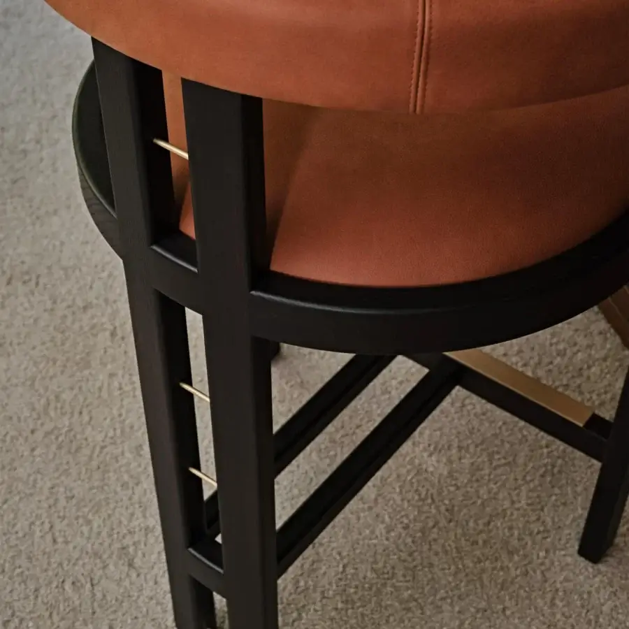 Captivating Black Tie Kumiko stool built with solid wood and reddish-brown leather upholstery in a matte finish