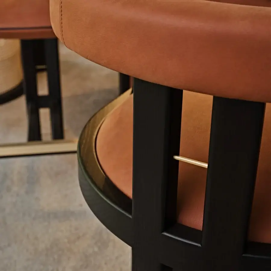 Distinguished Black Tie Kumiko stool crafted with solid wood and warm reddish-brown textile in a matte black finish