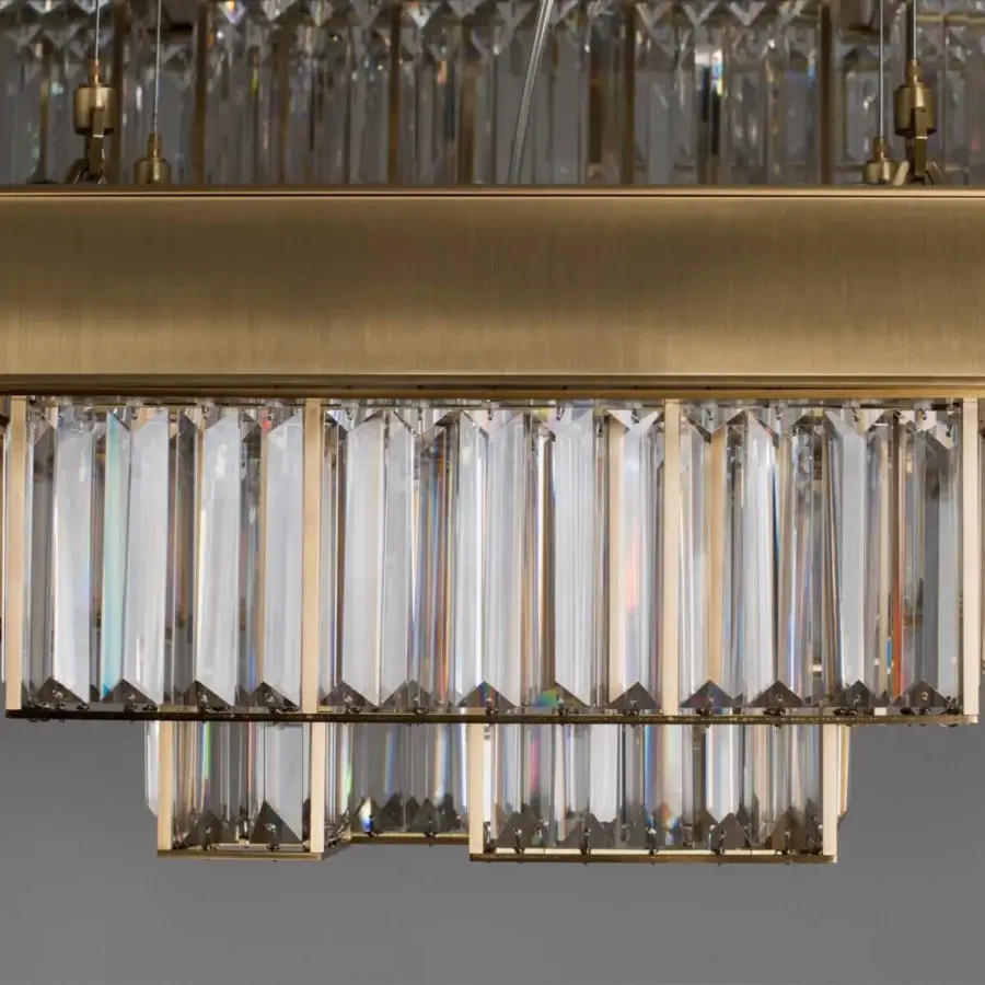 Exceptional Patrizia Garganti Gisele chandelier built in warm gold finish steel with cascading clear glass elements for adaptable lighting