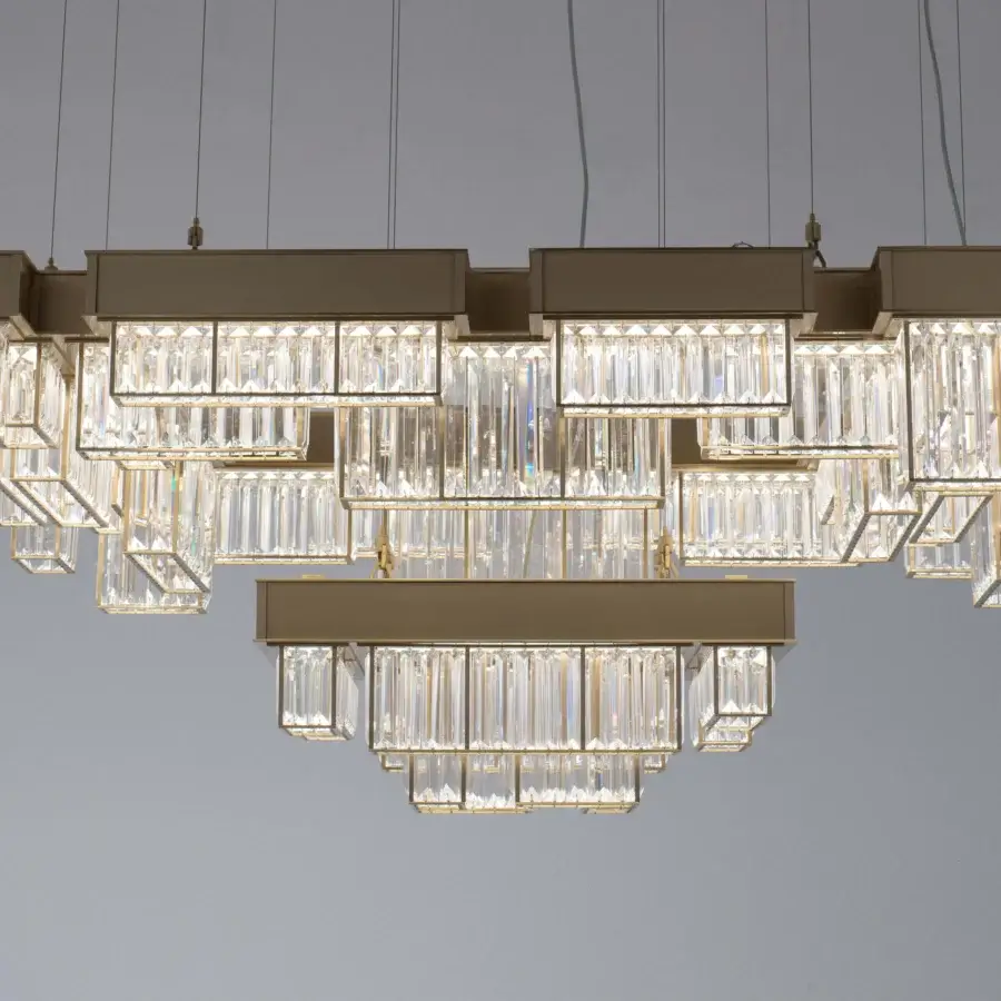 Superior Patrizia Garganti Gisele chandelier built with clear glass and muted gold-toned laser-cut steel with satin finish
