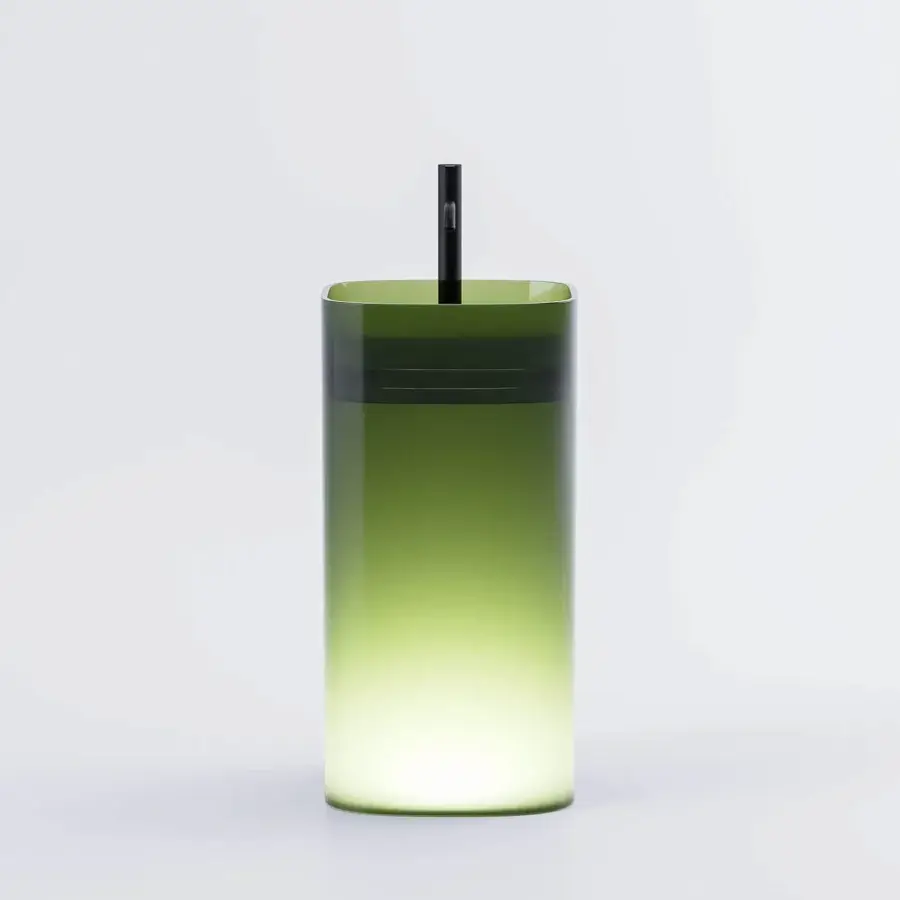 Captivating Norah Design CUCN 02 washbasin crafted in translucent Norahcrystal with a luminous green gradient and seamless silhouette