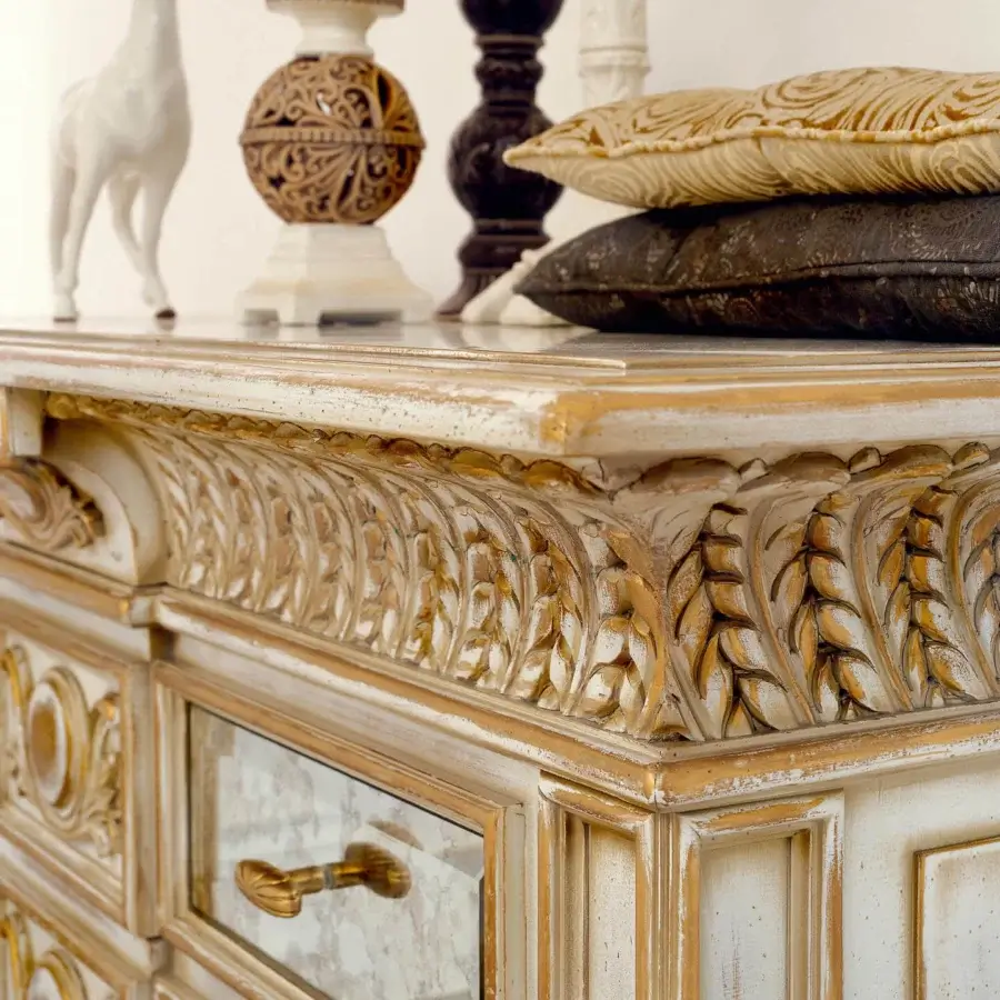 Distinguished Faber Mobili Constellation dresser crafted in creamy white and gold with carved floral motifs and antiqued mirrored drawer fronts