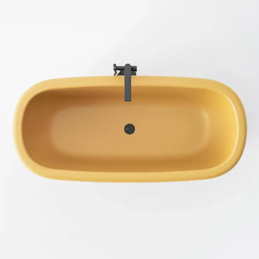 Distinguished Norah Design ARBT 01 bathtub with organic geometry crafted in warm yellow NorahCryl and velvety matte finish