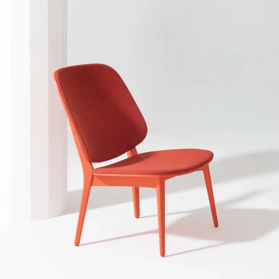 Exceptional Billiani Doll lounge chair with gently curved form and reddish-orange textured textile upholstery supported by painted metal