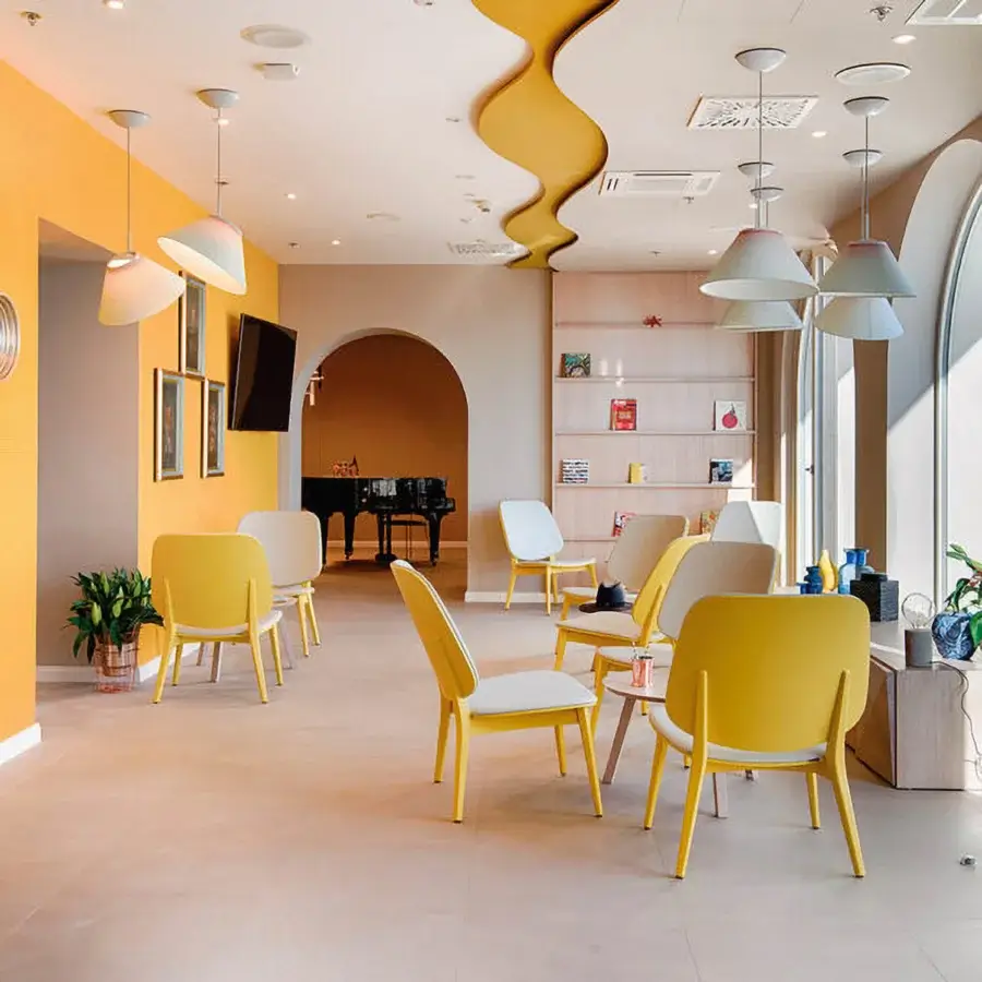 Superior Billiani Doll lounge chair with gently curved form and vibrant yellow molded synthetic material with smooth matte finish