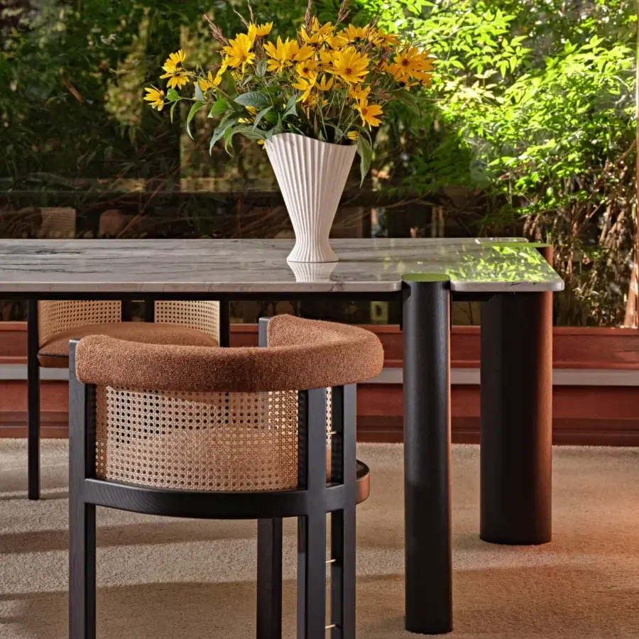 Exceptional Black Tie Kumiko chair with woven Vienna straw and satin-finish wood frame built with golden accent piping