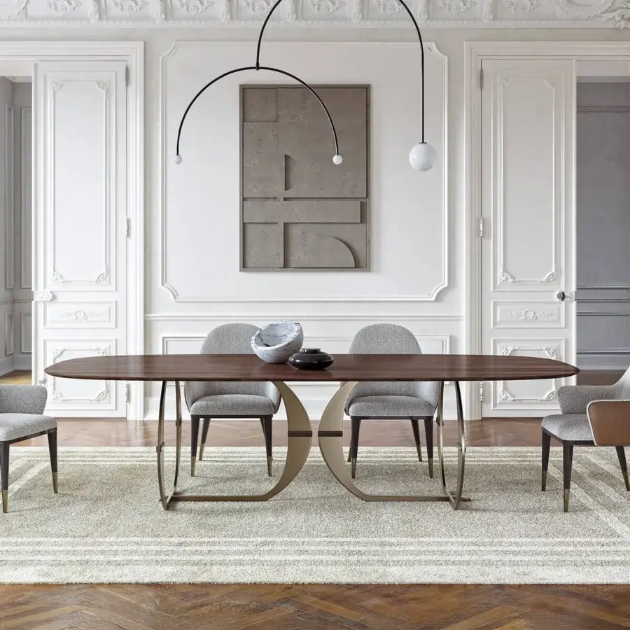Distinguished Capital Convivio table crafted with a satin finish wood tabletop and muted gold curved metal base