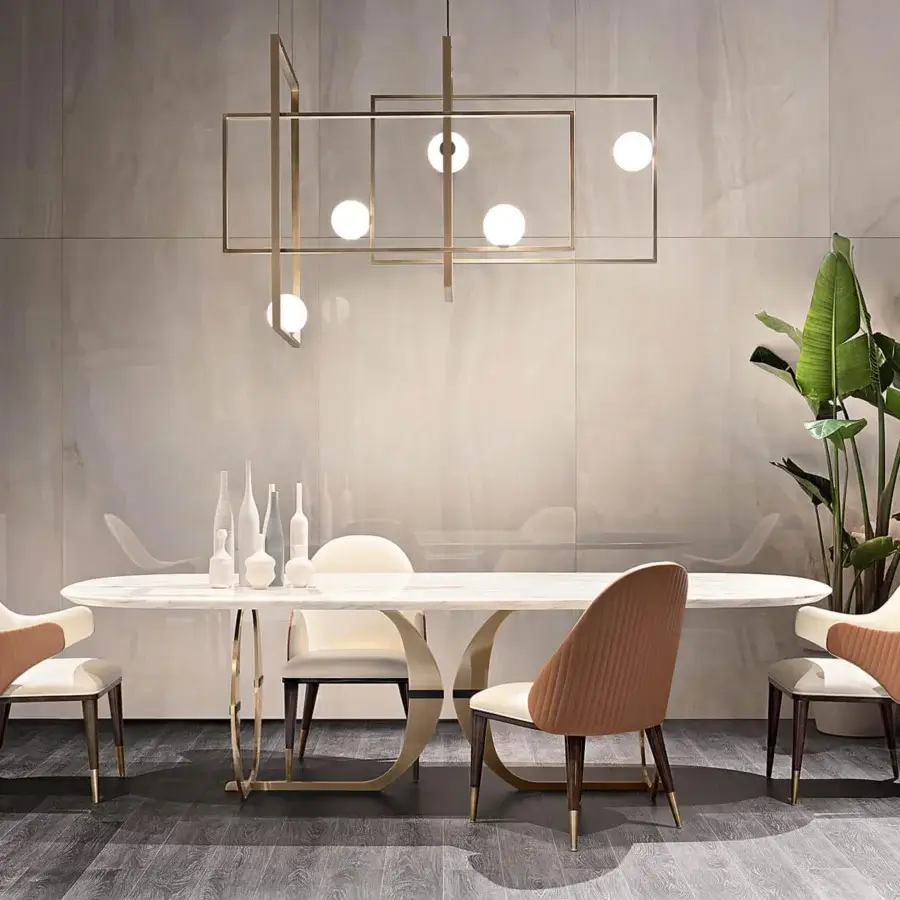 Superior Capital Convivio table with a sculpted marble tabletop exhibiting beige and cream veining in golden-toned metal with a satin finish