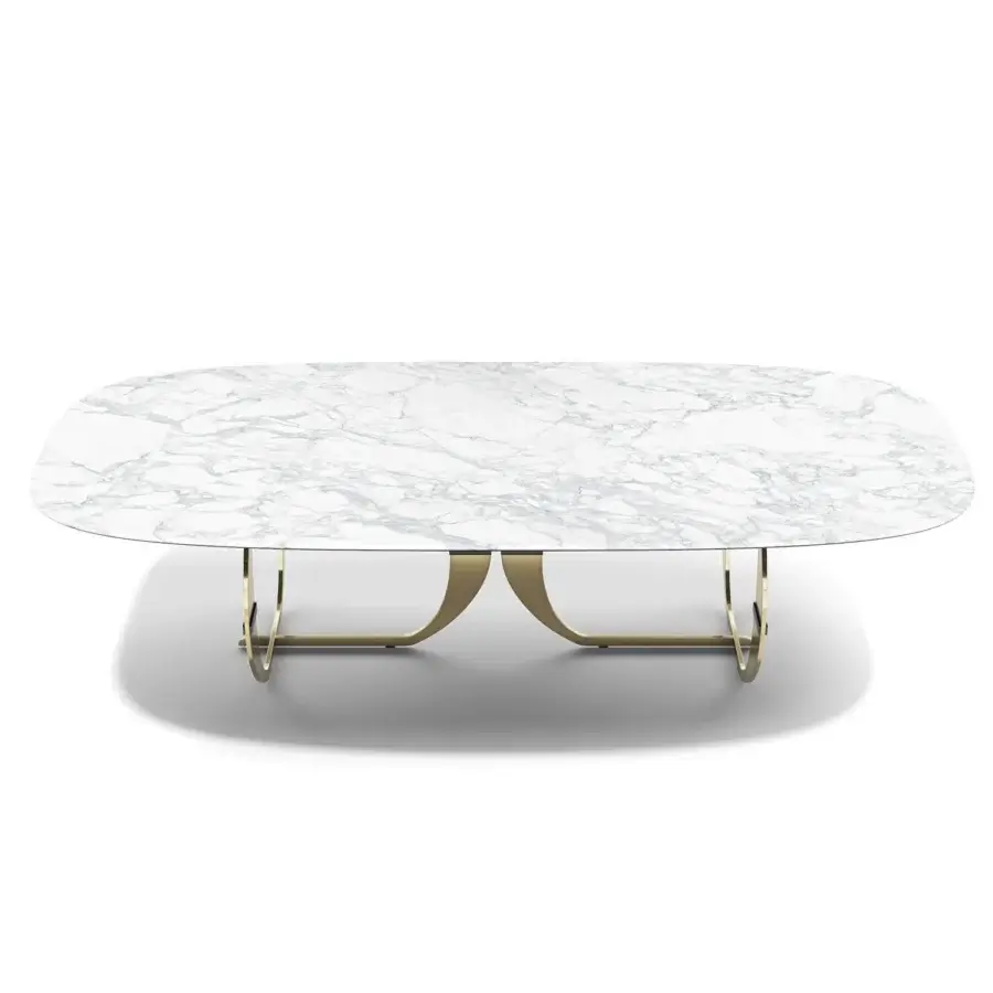 Distinguished Capital Convivio table with sculpted marble tabletop and curved golden-toned metal base in a matt lacquered finish