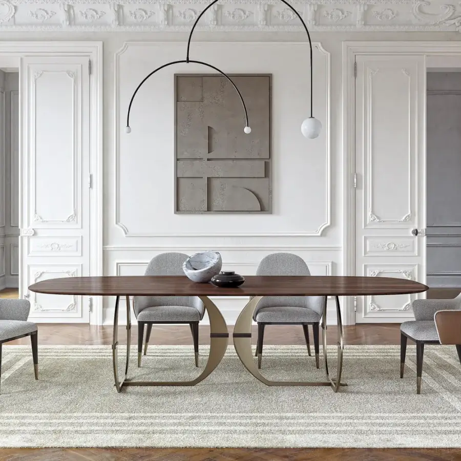 Captivating Capital Convivio table with sculpted wood tabletop and interconnected bronze-toned metal base in a satin finish