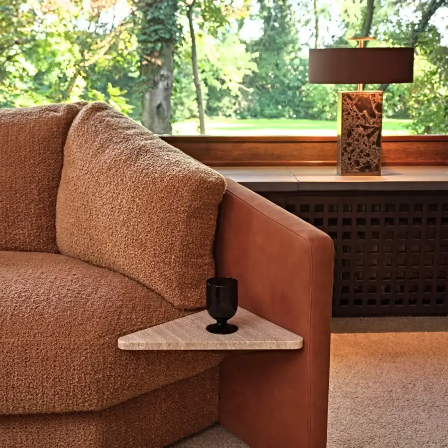 Captivating Black Tie Lilith sofa with reddish-brown textured textile upholstery and smooth leather armrests with integrated surface