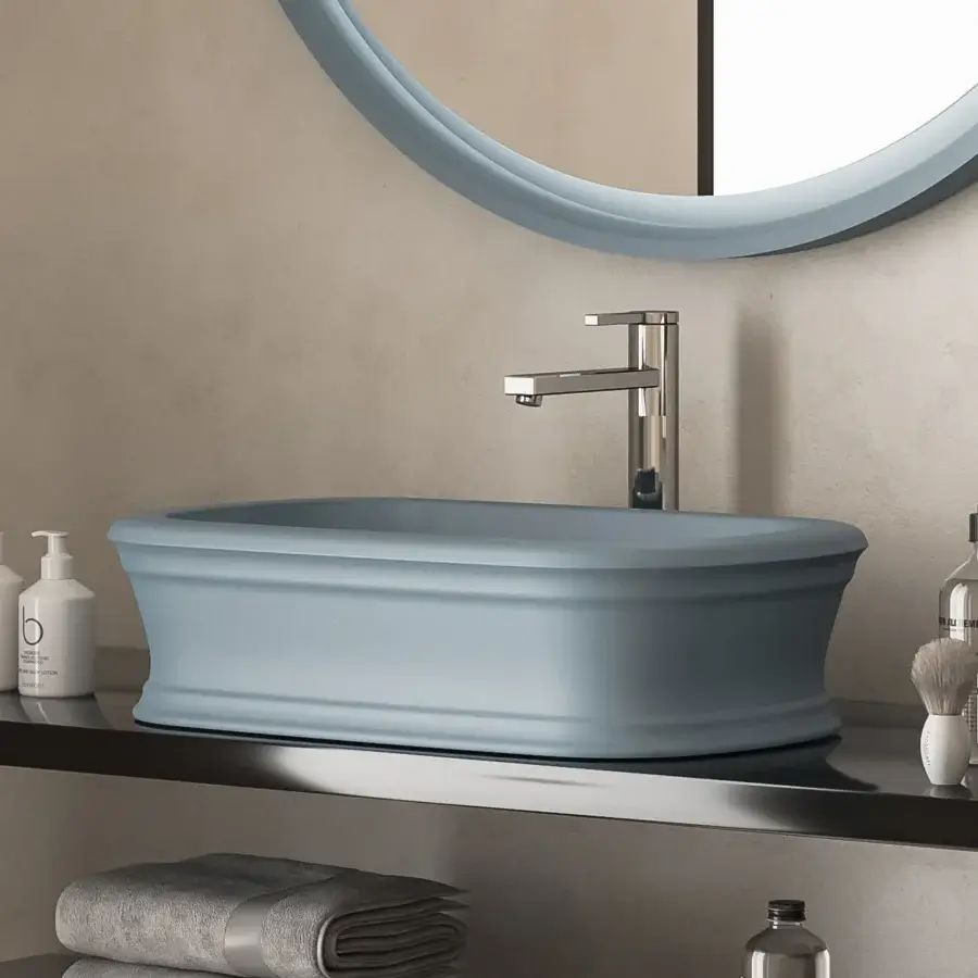 Elegant Norah Design ARBA 02 washbasin with sculpted form in muted blue-grey Norahcryl solid surface and velvety matte finish