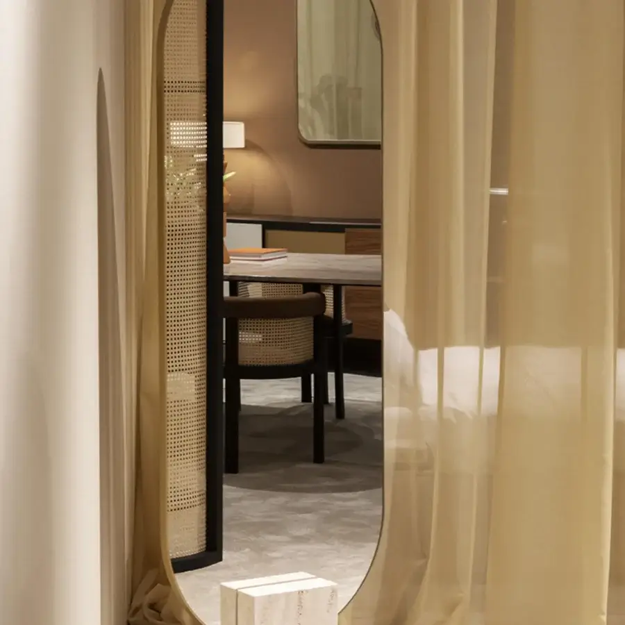 Exceptional Black Tie Tìam mirror crafted in Italy with a curved matte black metal arch and warm beige satin finish