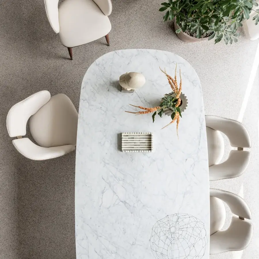 Exceptional Capital Ercole table crafted in polished white marble with striking grey veining and stylish metal insert
