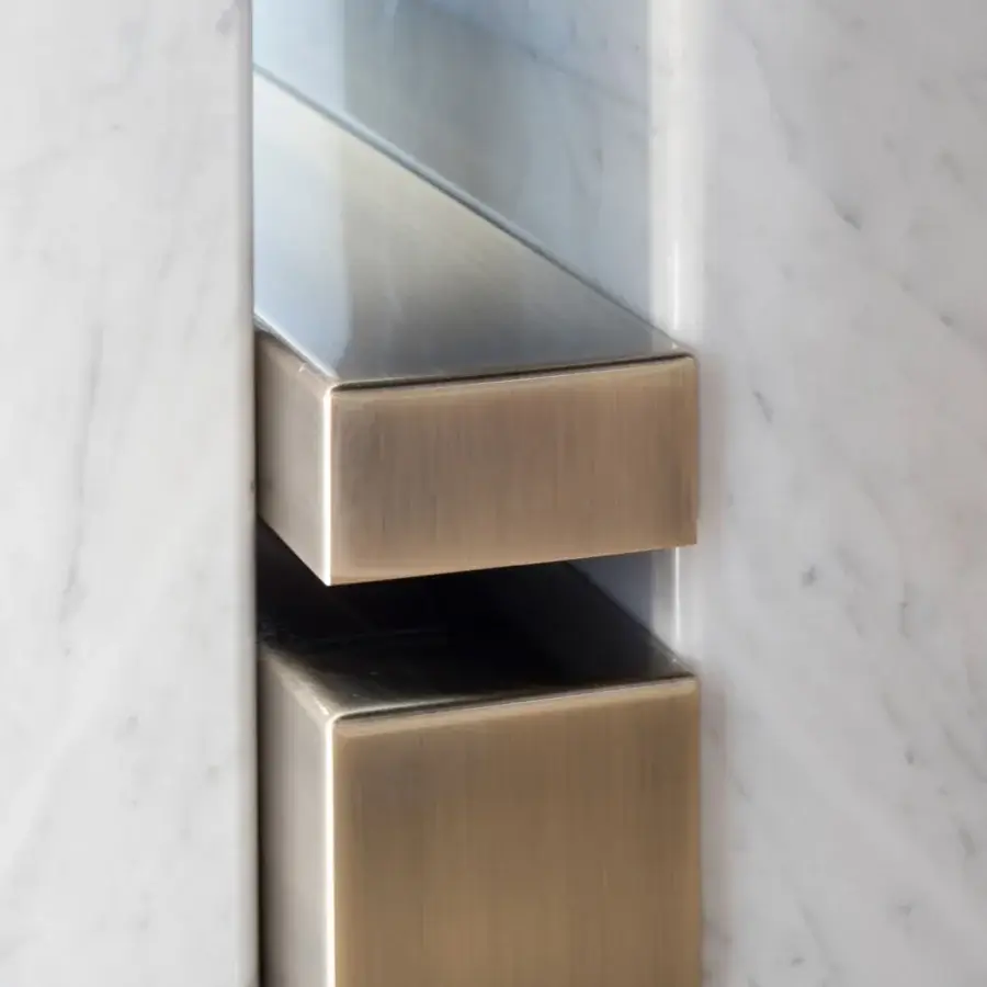Distinguished Capital Ercole table built in light marble with warm gold-toned metal drawer fronts and brushed satin finish