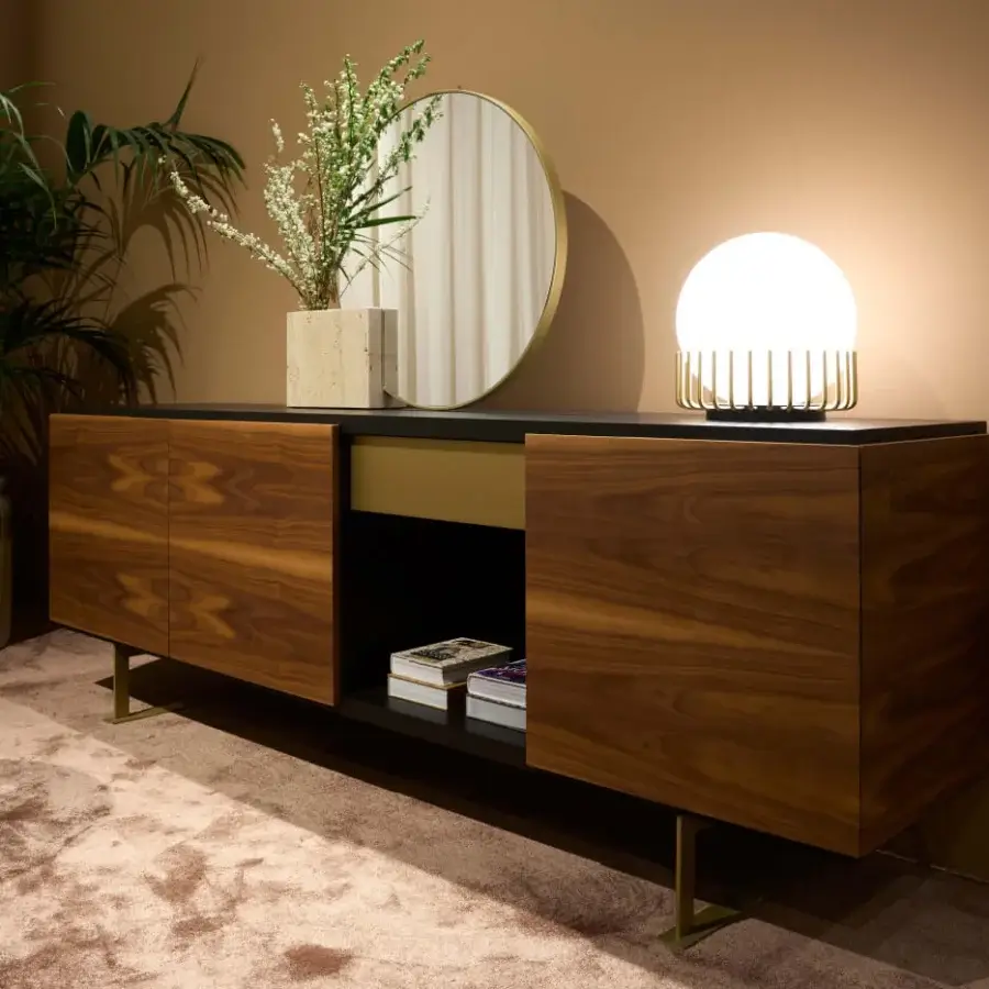 Exceptional Black Tie Sira sideboard crafted in Italy with satin wood and contrasting black band with gold-toned metal legs