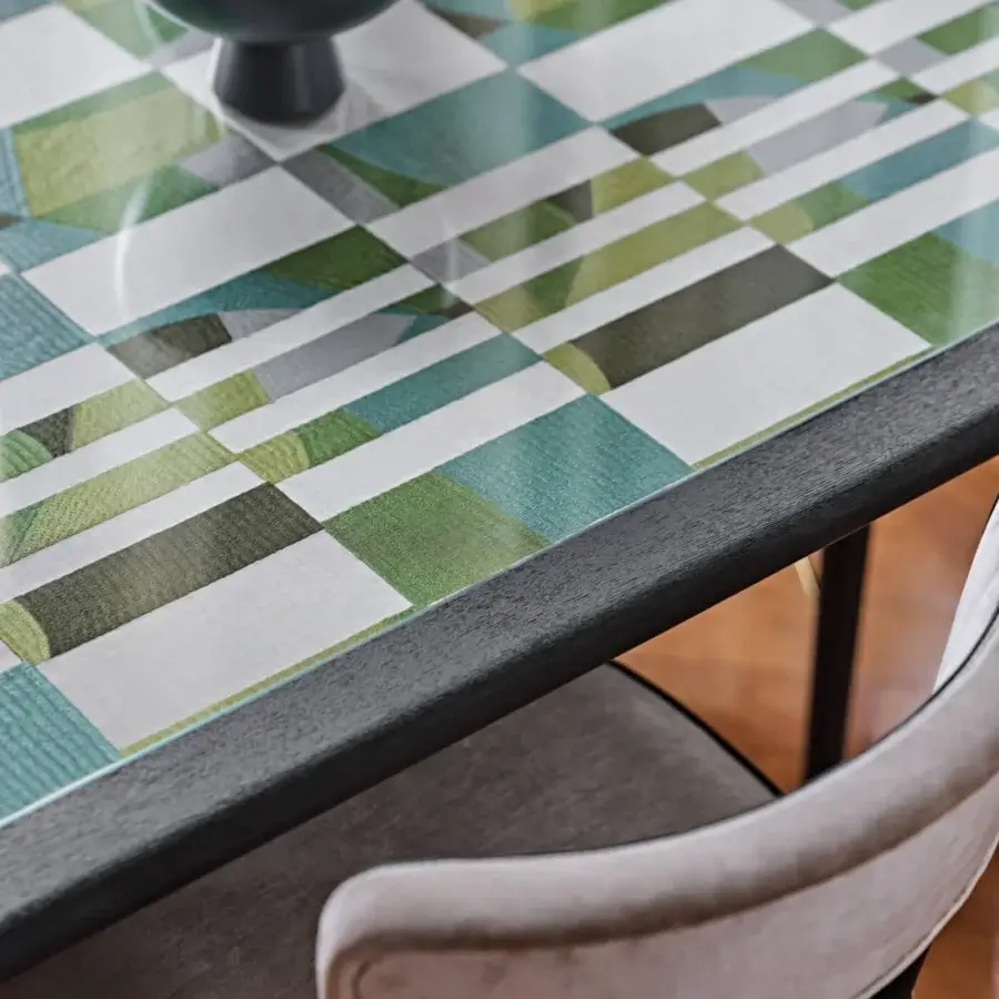 Luxury Black Tie Caius table with abstract mosaic tabletop in greens, whites and grays, built with dark-toned wooden legs and glossy finish