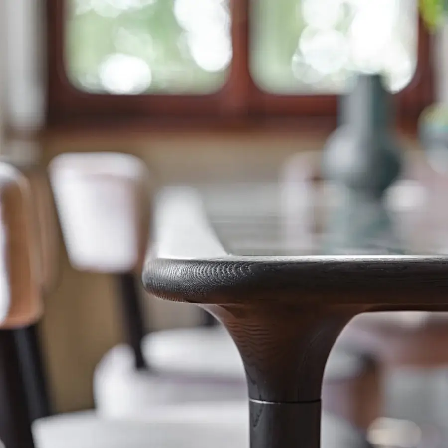 Distinguished Black Tie Caius table crafted in Italy with organically shaped pedestal base and satin finish dark-toned wood tabletop