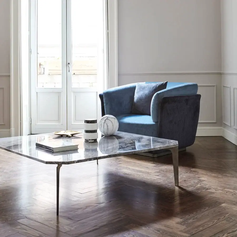 Distinguished Capital Allure lounge chair upholstered in plush dusty blue textile with a hidden wooden base and metal accents