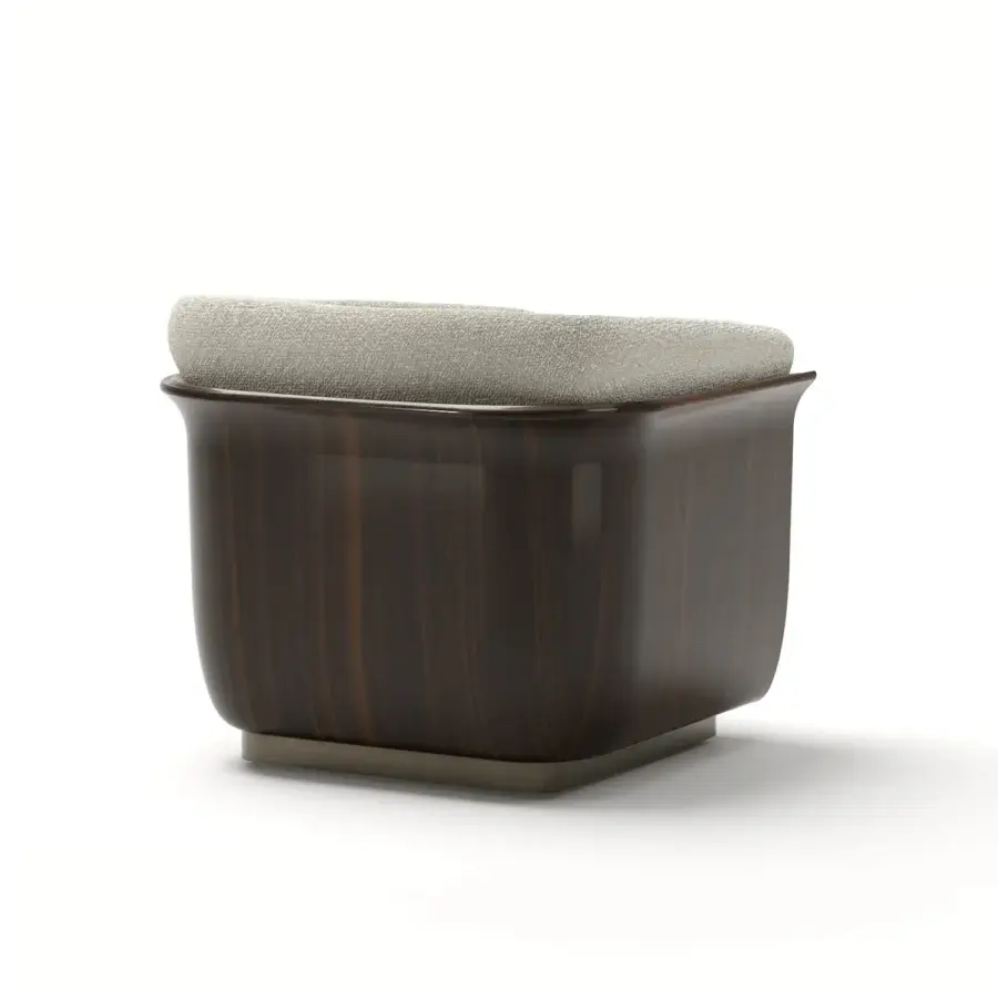 Refined Capital Allure lounge chair with plush neutral gray upholstery and a meticulously carved wooden frame with satin finish