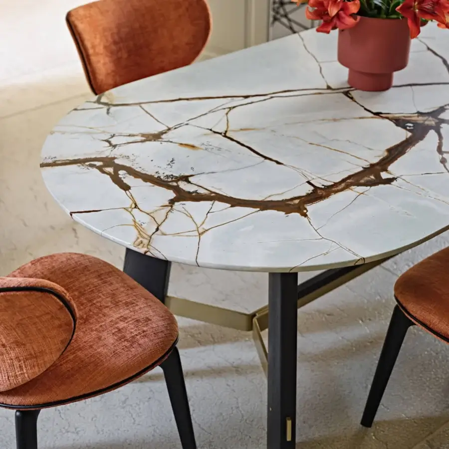 Exceptional Black Tie Medison table with white marble showcasing golden-brown veining and a glossy polished finish with dark wood