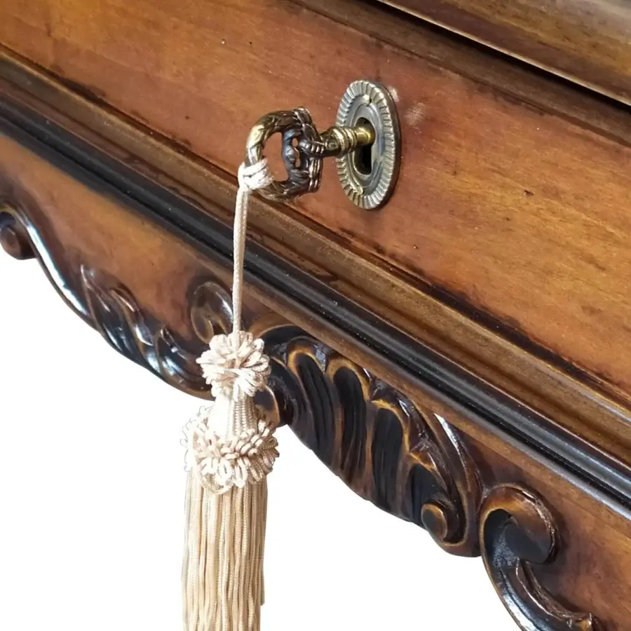 Elegant Faber Mobili Tiepolo desk crafted in warm brown walnut with intricate carved details and a glossy finish