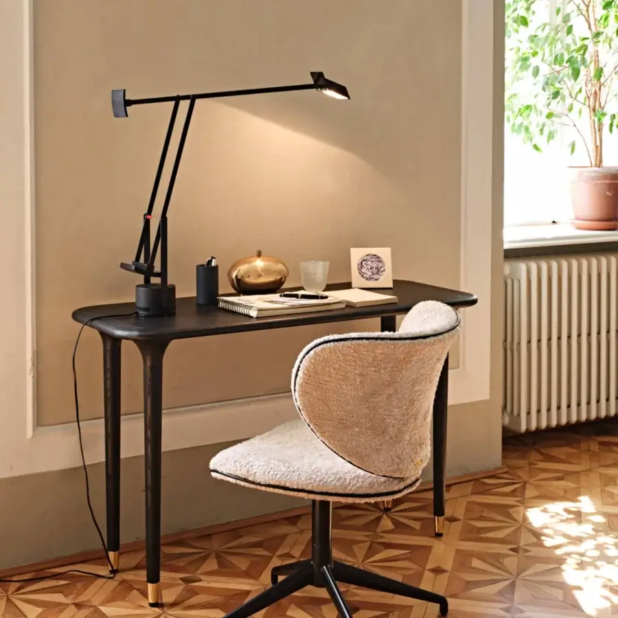 Distinguished Black Tie Livia console crafted in wood with a dark satin finish and slender gold-toned metal feet