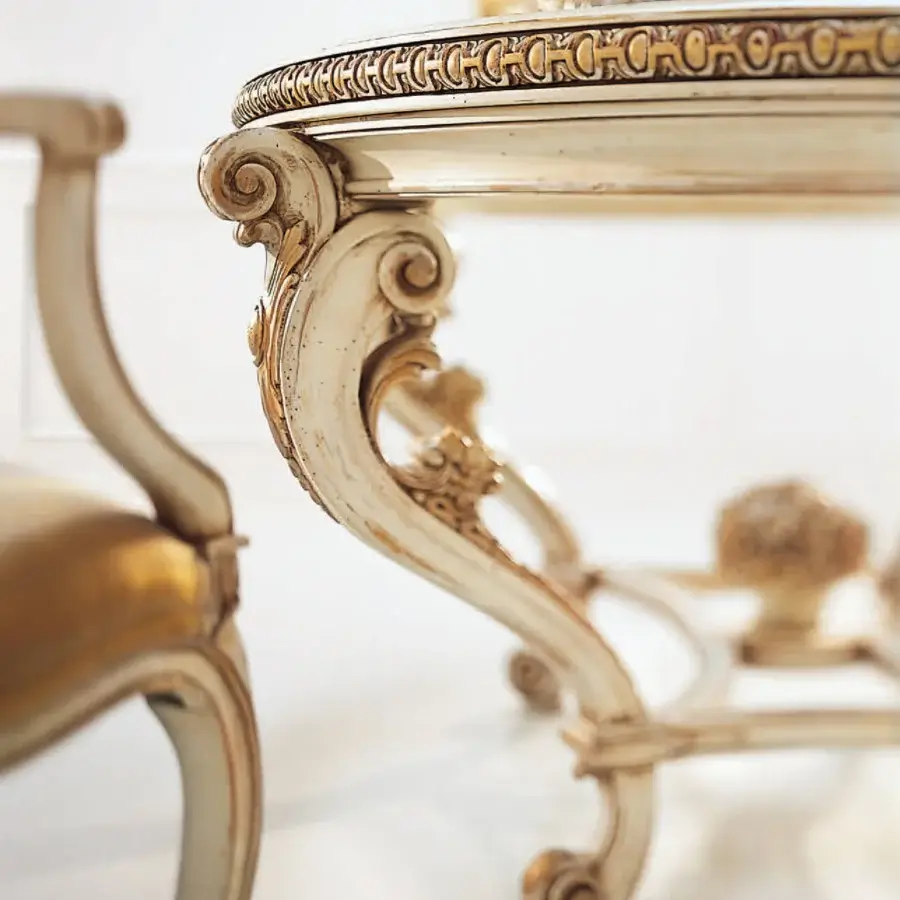 Superior Faber Mobili Ortensia table crafted with gilded wood, a glass top, and intricate scrolling foliage in an off-white finish