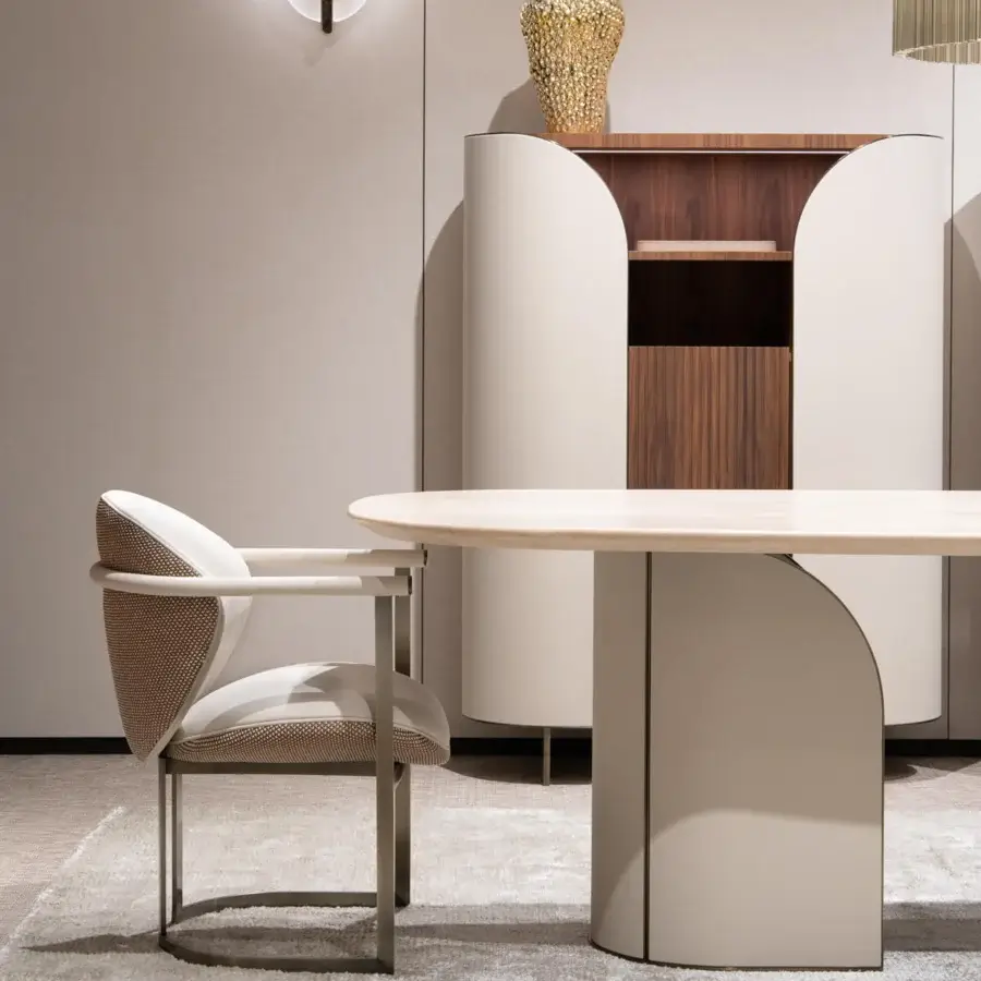 Elegant Capital Flora armchair with enveloping design crafted in off-white woven textile and galvanic aluminum structure
