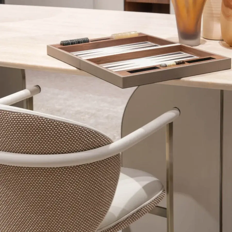 Distinguished Capital Flora armchair with soft shapes crafted in warm beige woven textile and light polyurethane composite armrests with galvanic finish