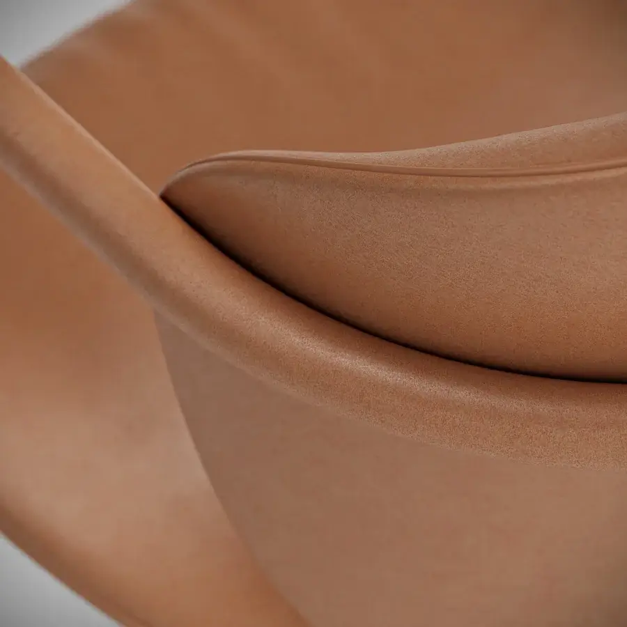 Exceptional Capital Flora armchair with fluid form, warm brown polyurethane composite upholstery and galvanic aluminum structure