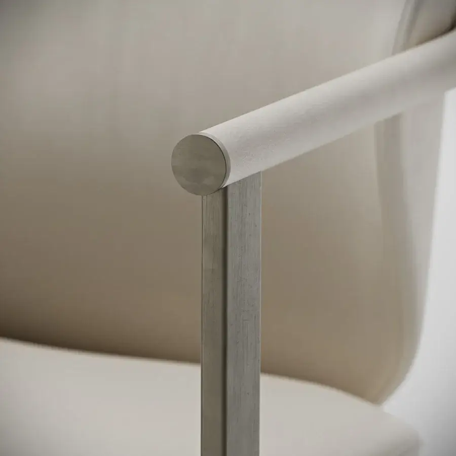 Distinguished Capital Flora armchair in muted beige polyurethane composite with galvanic aluminum structure and rounded leather armrest