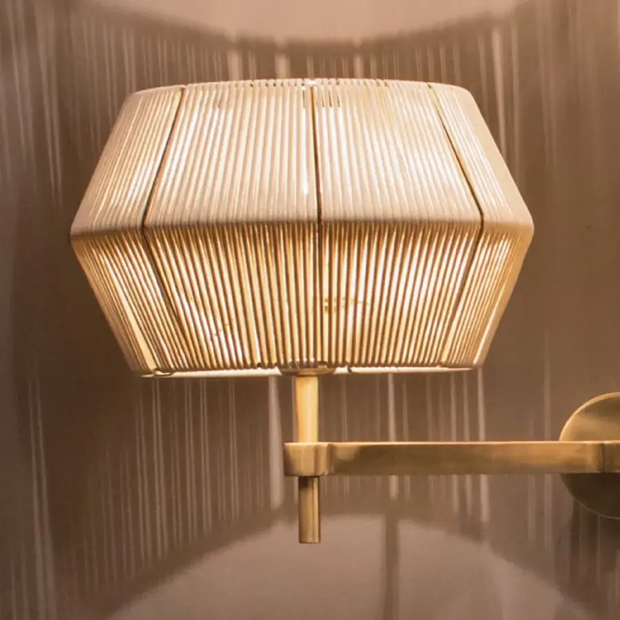 Distinguished Patrizia Garganti Novecento wall lamp with sculptural form crafted in warm golden-toned metal exhibiting a satin finish