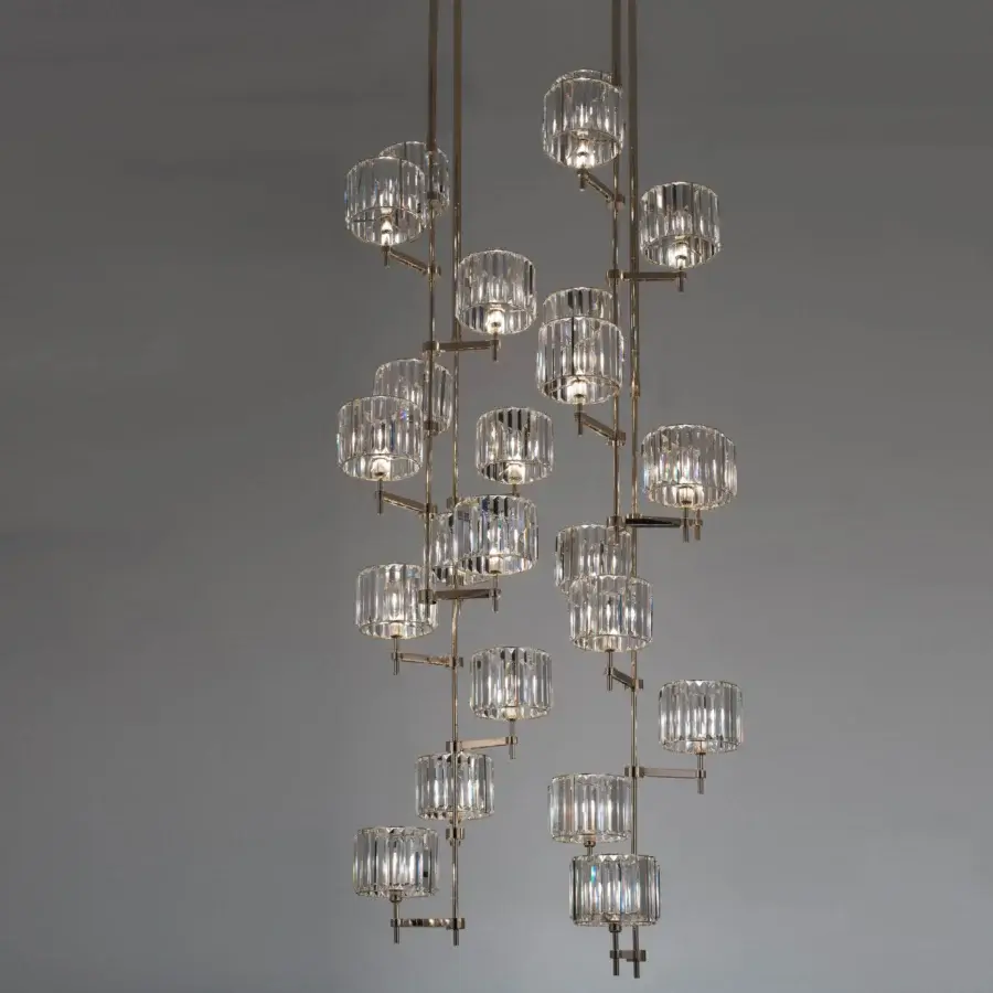Exceptional Patrizia Garganti Novecento EX04 chandelier with 24 clear crystal shades and refined brass-toned metallic structure