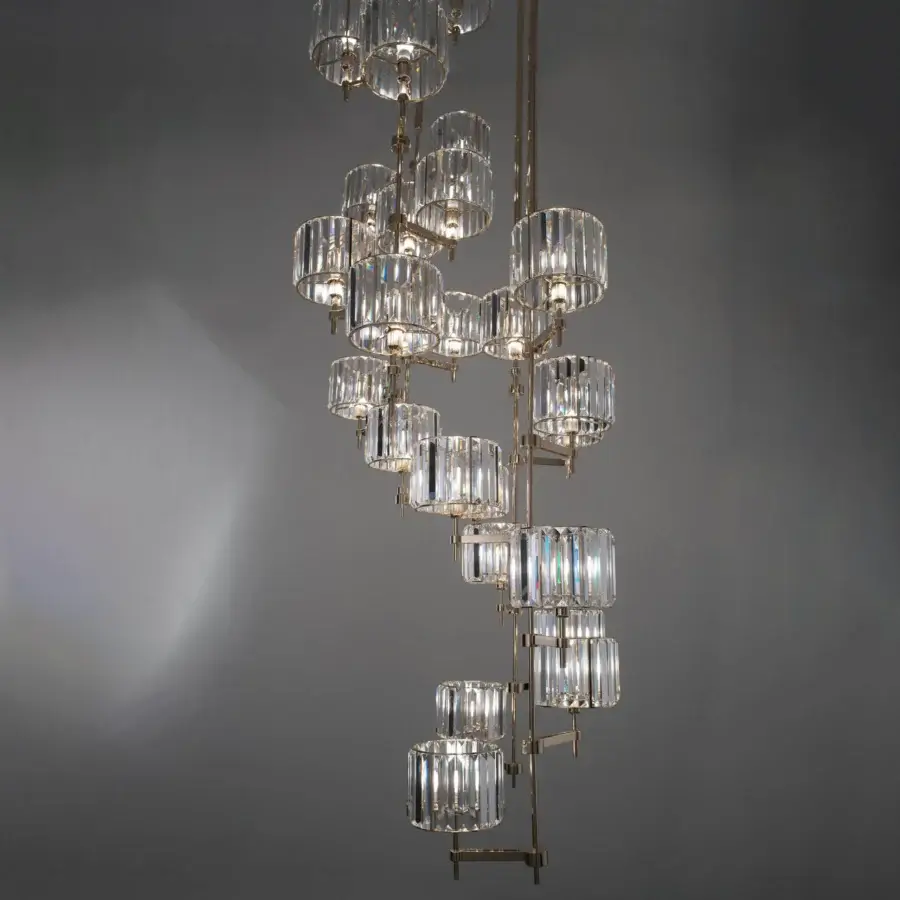 Elegant Patrizia Garganti Novecento EX04 chandelier with clear crystal cylinders suspended from polished gold-tone metallic structure
