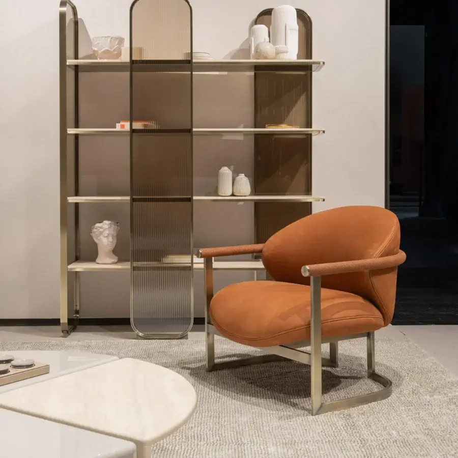 Lavish Capital Flora lounge chair with warm orange-brown leather upholstery and sleek galvanic aluminum structure