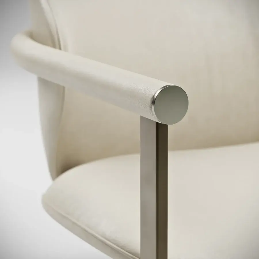 Sophisticated Capital Flora lounge chair with pale beige textile upholstery and satin tubular metal armrests crafted with a galvanic aluminum structure
