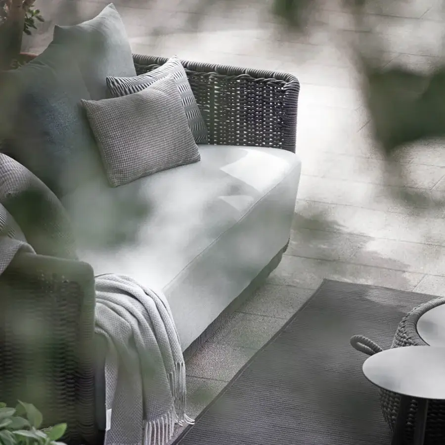 Elegant Atmosphera Bellagio sofa crafted in light gray with an open-weave melange-colored acrylic yarn design