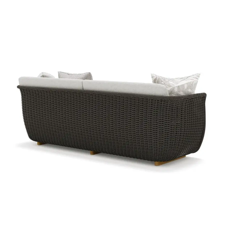 Superior Atmosphera Bellagio sofa woven with melange-colored acrylic yarn, light gray cushions and warm light brown wooden legs
